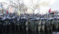 Riot police and members of the Ukrainian National Guard block activists and supporters of nationalist parties during a rally against trade with Ukraine's rebel-held east areas in Donetsk and Luhansk regions, in Kiev, Ukraine February 19, 2017. REUTERS/Val