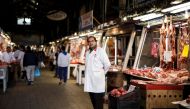 A butcher waits for clients inside the main meat market of Athens, Greece, February 17, 2017. REUTERS/Alkis Konstantinidis 