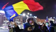 Romanians protest in front of the Romanian Government headquarters in Bucharest on February 21, 2017. Romanian MPs voted to definitively shelve a controversial decree that had sought to water down anti-corruption legislation but ended up unleashing the na