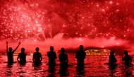 FILE PHOTO: People watch fireworks during New Year celebrations at Copacabana beach in Rio de Janeiro on January 1, 2016 (AFP / Yasuyoshi Chiba) 