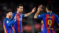 Barcelona's Argentinian forward Lionel Messi (L) celebrates with Barcelona's midfielder Sergio Busquets (C) and Barcelona's Uruguayan forward Luis Suarez after scoring during the Spanish league football match FC Barcelona vs Real Sporting de Gijon at the 
