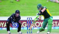 Faf du Plessis (right) of South Africa bats watched by Luke Ronchi of New Zealand during their fourth ODI at Seddon Park in Hamilton on March 1.