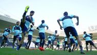Qatar national team players take part in a training session under the watchful eyes of coach Jorge Fossati in Doaha yesterday. 