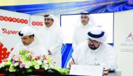 Officials of Ooredoo and Qatar Rail signing the agreement.