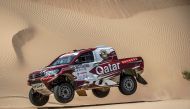Reigning FIA World Cup champion, Qatari driver Nasser Al Attiyah drives on sand dunes during the first leg of the Dubai International Baja yesterday.