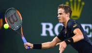 Vasek Pospisil of Canada returns the ball to Andy Murray of Great Britain in their second round match at the BNP Paribas Open at the Indian Wells Tennis Garden. Pospisil won 6-4, 7-6.