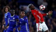 Manchester United's Paul Pogba in action with Chelsea's Willian and Victor Moses. Reuters / Eddie Keogh 