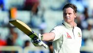 Australia's captain Steve Smith raises his bat while celebrating after scoring a century during the first day of the third Test against India at the Jharkhand State Cricket Association (JSCA) Stadium Complex in Ranchi.