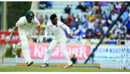Indian bowler Ravindra Jadeja (right) runs out Australian batsman Josh Hazlewood on the second day of the third Test cricket match at the Jharkhand State Cricket Association (JSCA) Stadium Complex in Ranchi.