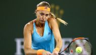 Kristina Mladenovic of France returns ashot to Elena Vesnina of Russia during the semifinals of the BNP Paribas Open at the Indian Wells Tennis Garden on March 17, 2017 in Indian Wells, California. Matthew Stockman/AFP
