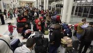 Syrian refugees, who were granted humanitarian visas by the Italian government gather at the departures hall in Beirut's International airport on March 1, 2017 ahead of their flight to Rome. AFP / JOSEPH EID