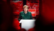 German Chancellor Angela Merkel leaves the stage after she delivered her speech at the official opening of the CeBIT technology fair in Hanover, central Germany, on March 19, 2017. AFP / Odd ANDERSEN
