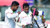 Bangladesh captain Mushfiqur Rahim (centre) and team-mates celebrate their victory over Sri Lanka on the fifth and final day of the second and final Test at The P. Sara Oval Cricket Stadium in Colombo on Sunday. 