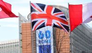 A Union Jack flag flies over a banner celebrating the 60th anniversary of 