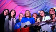 Monica Restrepo, president of the Colombia Hematology Foundation poses during a Carlos Vives guitar auction in Bogota, Colombia on March 22 2017 to support people affected by forest fires in Chile. Fire activity in Chile was worse than usual because of a 