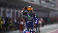 Movistar Yamaha MotoGP's Spanish rider Maverick Vinales celebrates after winning the 2017 Qatar MotoGP at the Losail International Circuit, north of the capital Doha on March 26, 2017. Spain's Maverick Vinales of Movistar Yamaha MotoGP won the season-open