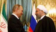Russian President Vladimir Putin shakes hands with Iranian President Hassan Rouhani during their meeting at the Kremlin in Moscow, Russia March 28, 2017. REUTERS/Sergei Karpukhin
