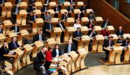 Scotland's First Minister Nicola Sturgeon stands and speaks in the chamber on the second day of the 'Scotland's Choice' debate on a motion to seek the authority to hold an indpendence referendum, at the Scottish Parliament in Edinburgh, on March 28, 2017.