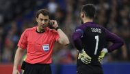 Referee Felix Swayer asks video assitance next to Hugo Lloris France's goalkeeper during the friendly football match France vs Spain on March 28, 2017 at the Stade de France stadium in Saint-Denis, north of Paris. / AFP / CHRISTOPHE SIMON
