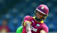 West Indies' Evin Lewis hits a boundary during the third T20I against Pakistan at the Queen's Park Oval in Port of Spain, Trinidad, on Saturday. 