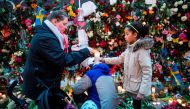Well wishers place flowers and candles at a makeshift memorial outside a department store in Stockholm on April 8, 2017. AFP / Odd ANDERSEN
