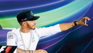 British Formula One driver Lewis Hamilton of Mercedes AMG GP takes a selfie during a press conference of the Australian Formula One Grand Prix in Melbourne, in this March 2016 file photo. 