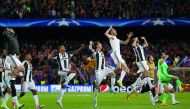 Juventus players celebrate after winning the UEFA Champions League quarter-final second leg football match against FC Barcelona at the Camp Nou Stadium in Barcelona.