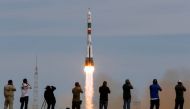 Photographers take pictures as the Soyuz MS-04 spacecraft carrying the crew of Jack Fischer of the U.S. and Fyodor Yurchikhin of Russia blasts off to the International Space Station (ISS) from the launchpad at the Baikonur Cosmodrome, Kazakhstan, April 20