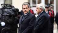 Former French President Nicolas Sarkozy (L) and former French Prime Minister, Jean-Pierre Raffarin attend a ceremony honouring the policeman killed by a jihadist in an attack on the Champs Elysees, on April 25, 2017 at the Paris prefecture building. AFP /