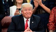 US President Donald Trump smiles during a national teacher of the year event in the Oval Office of the White House April 26, 2017 in Washington, DC. / AFP / Brendan Smialowski
