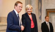 French presidential election candidate for the far-right Front National (FN) party Marine Le Pen (R), flanked by Former French presidential election candidate for the right-wing Debout la France (DLF) party Nicolas Dupont-Aignan (L), gestures as she speak