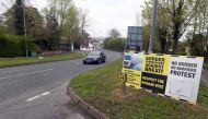 In this photograph taken on April 26, 2017, Brexit posters are pictured at the border crossing at Muff in Co Donegal near Lough Foyle, on the border with Northern Ireland and Donegal in the Republic of Ireland. AFP / PAUL FAITH
