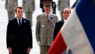 Outgoing French President Francois Hollande (R) and President-elect Emmanuel Macron (L) attend a ceremony marking the 72nd anniversary of the victory over Nazi Germany during World War II on May 8, 2017 in Paris. / AFP / POOL / Francois Mori.