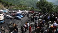 GOLESTAN, IRAN - MAY 3 : Iranian emergency personnel and mine workers gather around the Azadshahr coal mine in northern Iran, Golestan on May 3, 2017. Media reported that at least 35 workers died after the incident. ( Stringer - Anadolu Agency ).