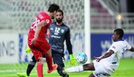 Lekhwiya's  Youssef Msakni (left) scores their second goal against Saudi Arabia's Al Fateh during the AFC Champions League football match played at the Abdullah bin Khalifa stadium in Doha yesterday. Lekhwiya registered an emphatic 4-1 win to confirm them