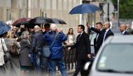 France's president-elect Emmanuel Macron walks in a street, on May 11, 2017 in Paris. AFP / Philippe Lopez