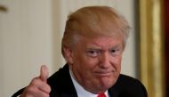 U.S. President Donald Trump gestures while attending a “celebration of military mothers'' at the White House in Washington, U.S., May 12, 2017. REUTERS/Kevin Lamarque
