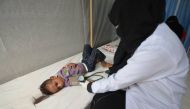 A nurse attends to a boy infected with cholera at a hospital in the Red Sea port city of Hodeidah, Yemen May 14, 2017. REUTERS/Abduljabbar Zeyad
