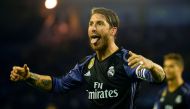 Real Madrid's defender Sergio Ramos celebrates their third goal sticking out his tongue at Celta's supporters during the Spanish league football match RC Celta de Vigo vs Real Madrid CF at the Balaidos stadium in Vigo on May 17, 2017. / AFP / MIGUEL RIOPA