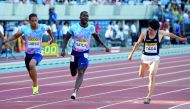 Justin Gatlin of the US leads Japanese runners Aska Cambridge (left) during their men's 100m event during the Golden Grand Prix track and field meet in Kawasaki, a suburb of Tokyo 