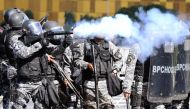 Riot police clash with demonstrators demanding the resignation of embattled President Michel Temer (AFP Photo/EVARISTO SA).