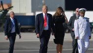 US President Donald Trump and US First Lady Melania Trump walk to board Air Force One before departing from US military Naval Air Station Sigonella following a G7 summit of Heads of State and Government, on May 27, 2017 near Taormina in Sicily. (AFP / MAN