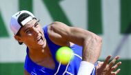 Spain's Rafael Nadal serves during a practice session on the eve of the first round of the French Open tennis tournament in Paris, yesterday.