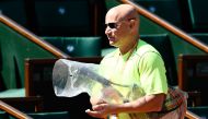 US coach Andre Agassi arrives for a training session ahead of the Roland Garros 2017 French Tennis Open on May 26, 2017 in Paris. Andre Agassi will coach Serbia's player Novak Djokovic during the French Open. (AFP / CHRISTOPHE SIMON)