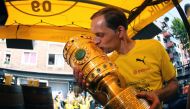 (FILES) This file photo taken on May 28, 2017 shows Dortmund's head coach Thomas Tuchel kissing the trophy at Borsigplatz during celebrations after winning the German Cup final (DFB Pokalfinale) in Dortmund, western Germany.  AFP / POOL / Ina FASSBENDER
