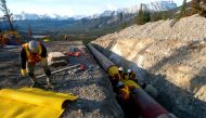 FILE PHOTO: Workers construct the Anchor Loop section of Kinder Morgan's Trans Mountain pipeline expansion in Jasper National Park in a 2009 file photo. Kinder Morgan Canada/Handout via REUTERS