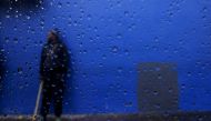 A job seeker is seen through a car window as he waits for casual work as a builder outside a hardware store in Cape Town, South Africa. ( REUTERS/Mike Hutchings/File Photo)