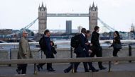 People walk on London Bridge in London, on June 6, 2017, a day after it reopened following the June 3 terror attack on the bridge and at Borough market. (AFP / Odd ANDERSEN)