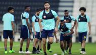Qatar's Ahmed Al Sayed (centre) along with his team-mates during a training session ahead of the World Cup Qualifying match against South Korea. The match will be played in Doha today. 