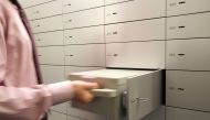 An employee checks a safe box at the vault of Swiss UBS bank in Zurich-Zollikon, Switzerland January 21, 2009. (REUTERS/Arnd Wiegmann/File Photo)